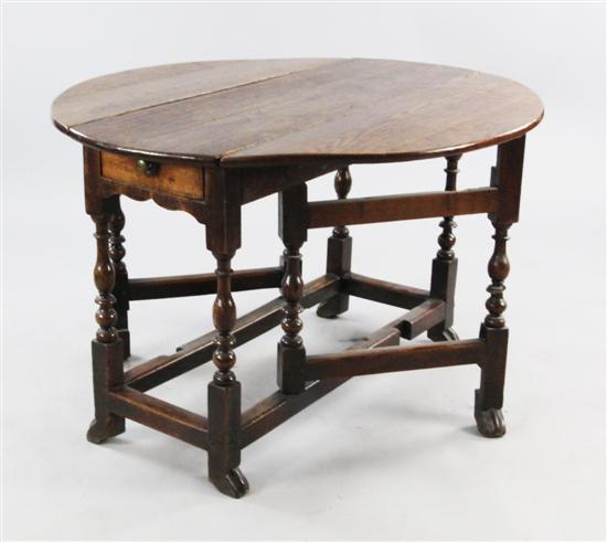 Carved oak occasional table with turned underframe